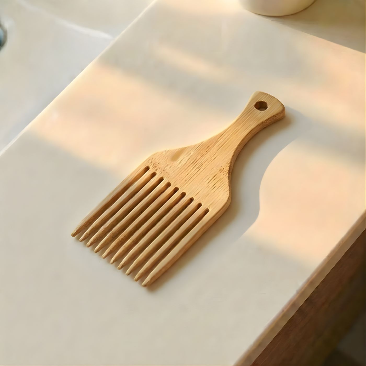 Eco friendly bamboo hair comb on vanity 2