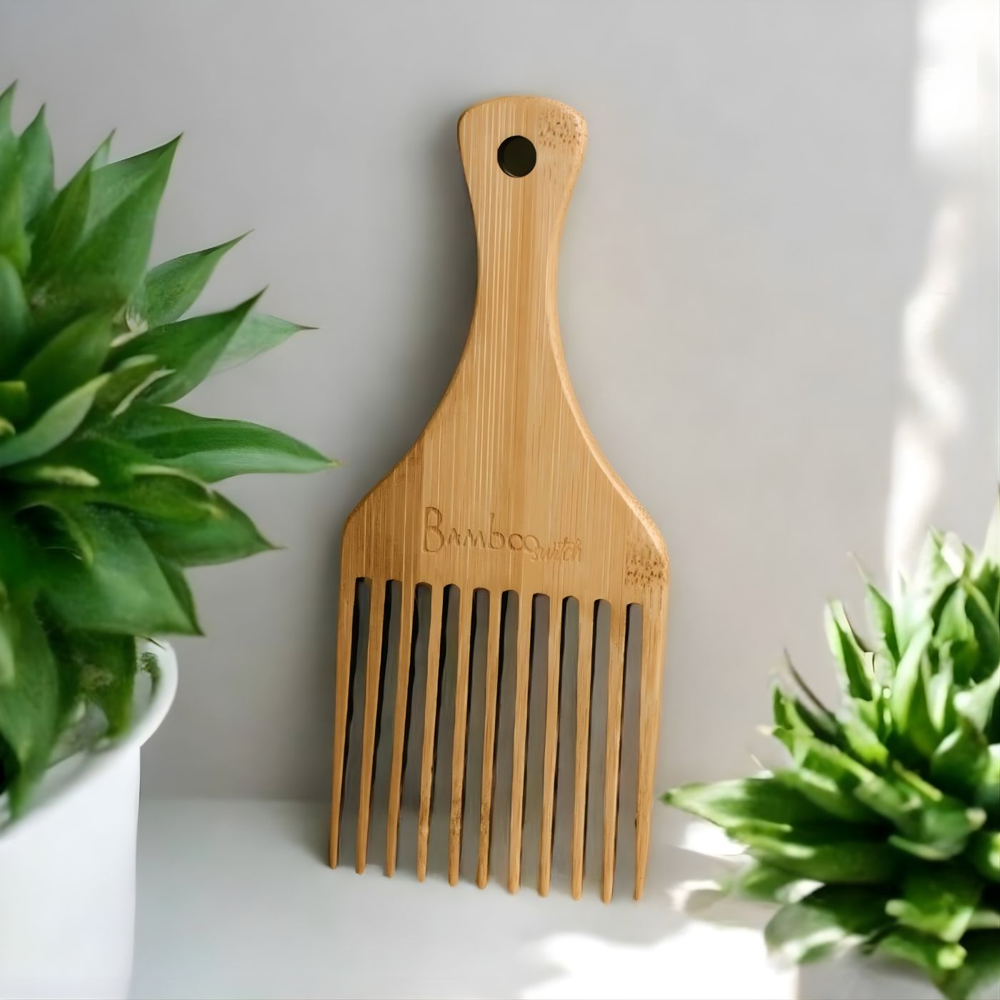 Eco friendly bamboo hair comb on vanity