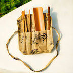 Bamboo loose tea tool set in cotton pouch on table