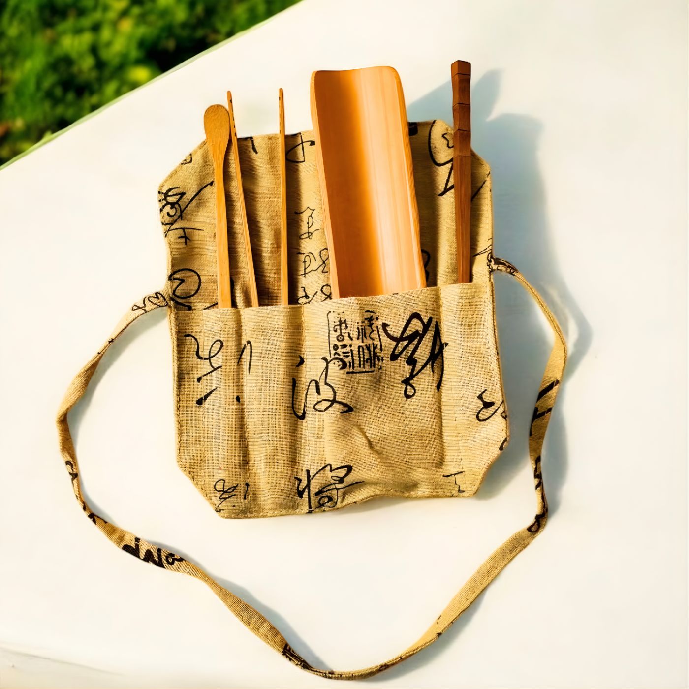 Bamboo loose tea tool set in cotton pouch on table