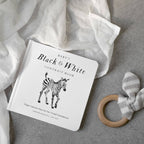 Black and white tummy time book with lifelike animal artwork