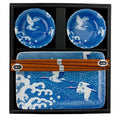 Blue ceramic sushi set with crane design plates, sauce dishes, and chopsticks in black gift box