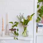 Botanical keeper flower arrangement on glass