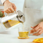 Stainless steel french press tea maker pouring tea