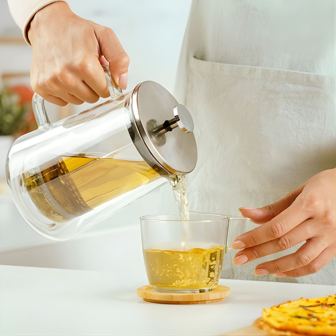 Stainless steel french press tea maker pouring tea