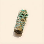 Close-up of wildflowers on white sage smudge stick - aqua