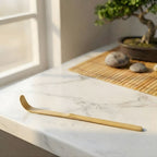 Natural bamboo scraping spoon on counter