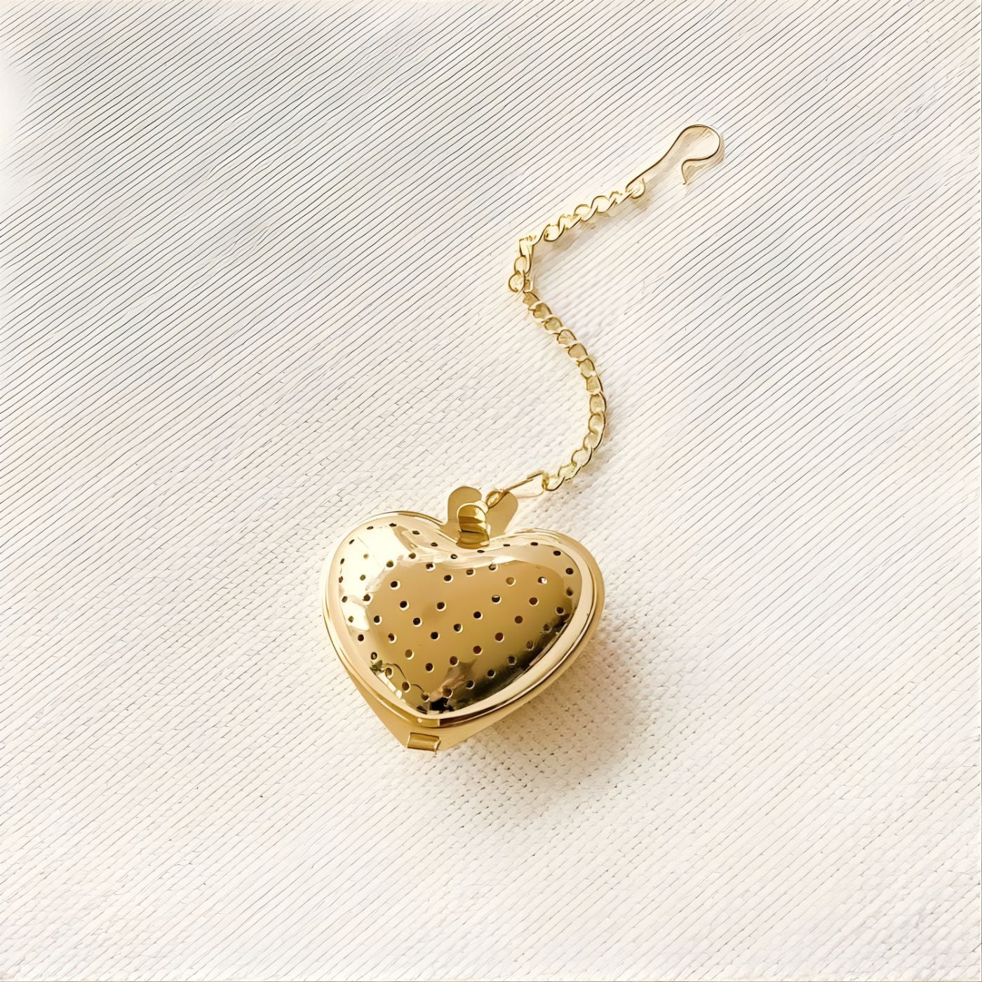 Gold heart tea ball with fine mesh design