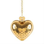 Close-up of gold mesh and latch on heart tea infuser