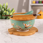 Jade green crane bowl with porcelain spoon and bamboo trivet