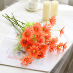 Faux daisy flower in orange