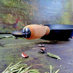 Cast iron skillet with wooden handle