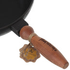 Cast iron skillet with wooden handle