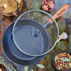 Family-size cast iron skillet with wooden handle
