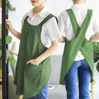 Green cross-back kitchen apron with two front pockets