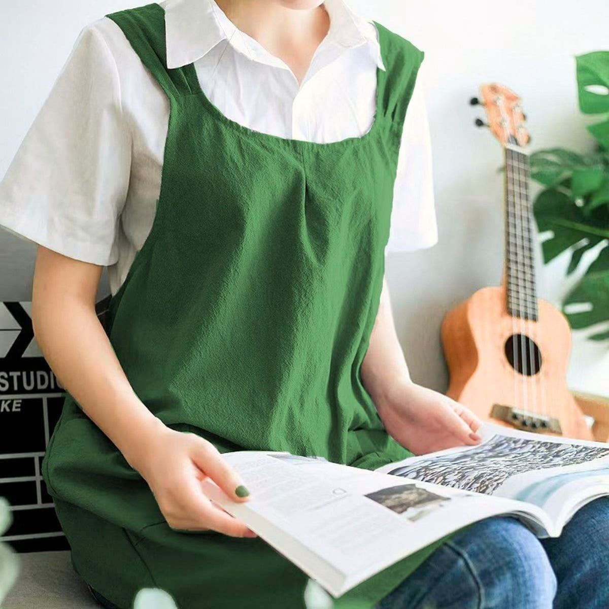 Green cotton and linen work apron with cross-back design