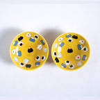 Yellow onigiri sauce dishes with rice ball chopstick rests