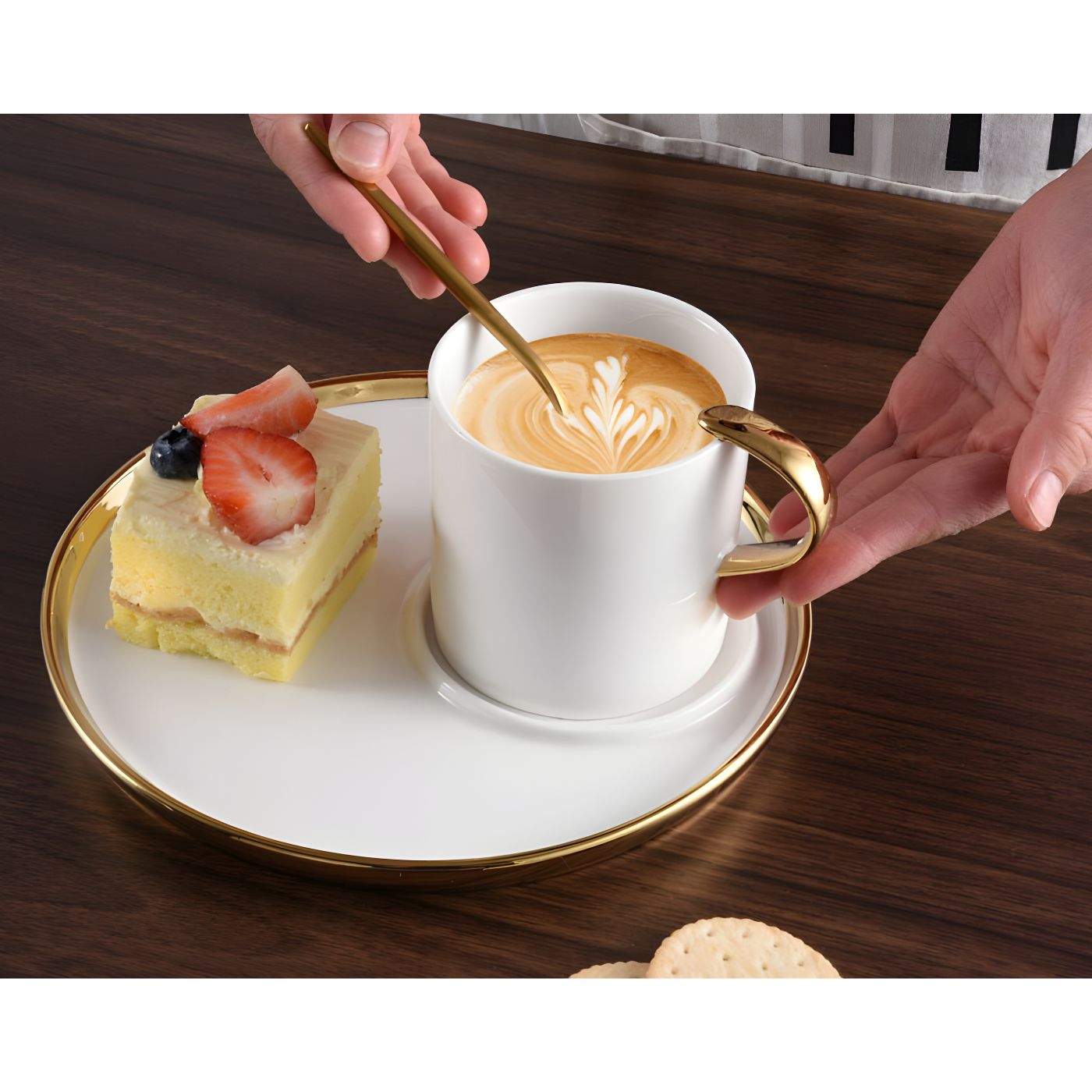 A cup of cappuccino and a piece of cake served in the Pampa Bay cappuccino cup and saucer gift set