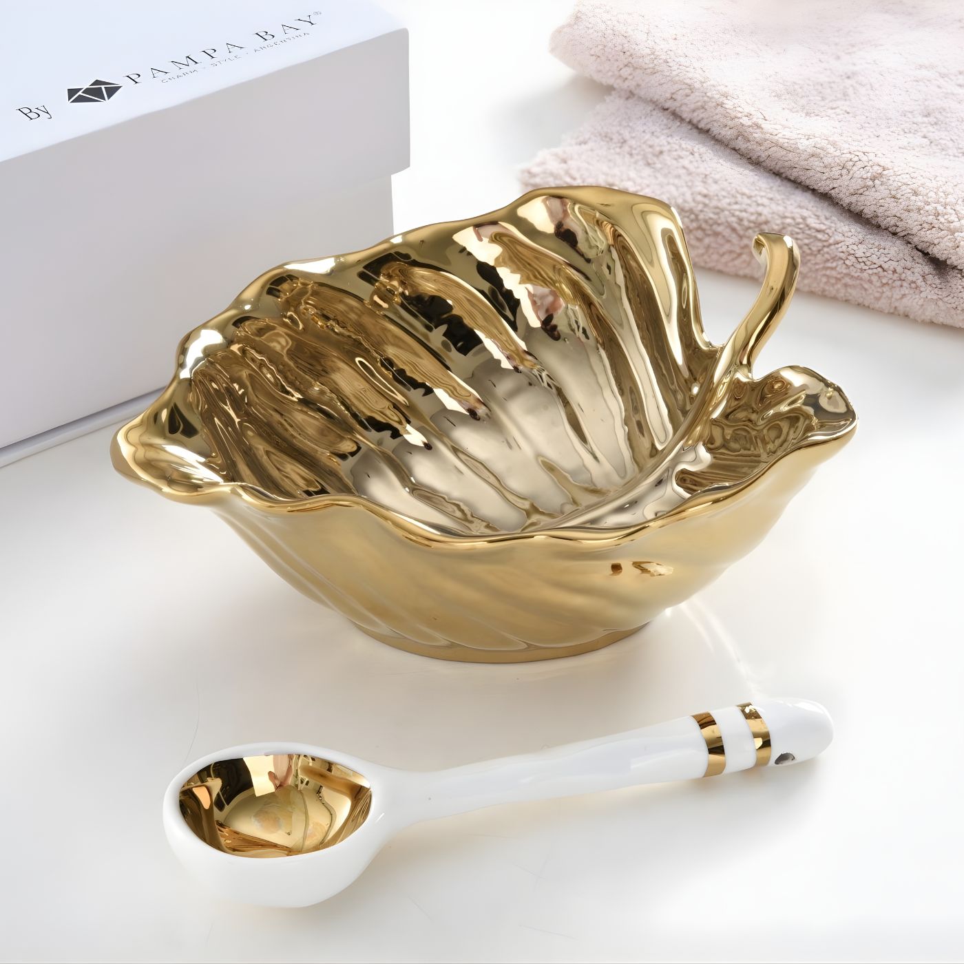 Gold leaf porcelain bowl with matching white porcelain spoon with gold trim