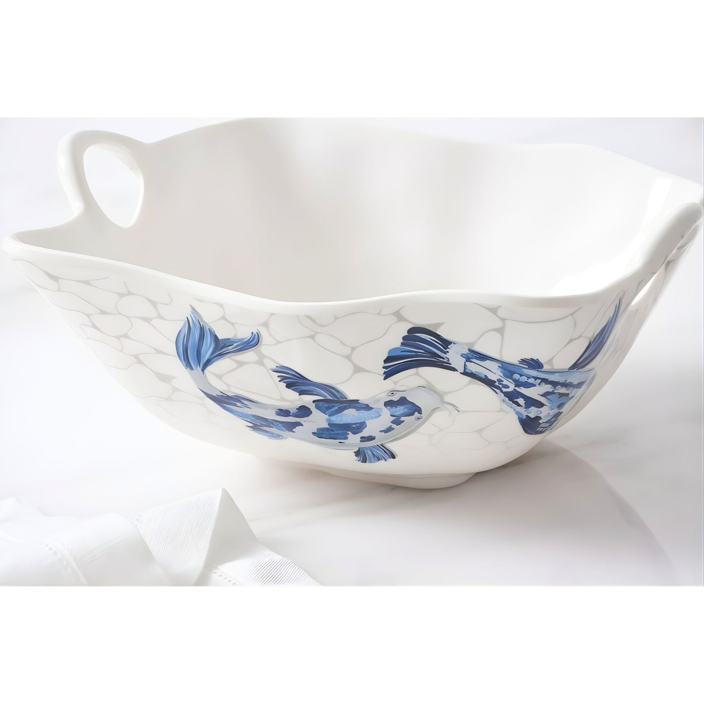 Close-up of koi artwork on melamine serving bowl