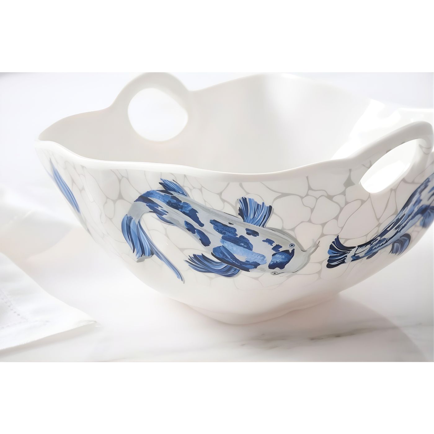 Close-up of koi artwork on melamine serving bowl