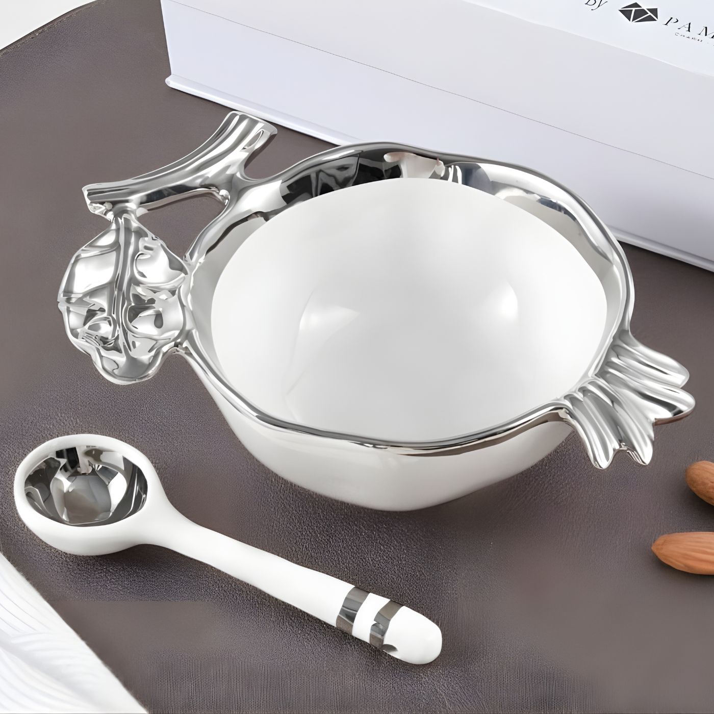 Pomegranate shaped porcelain serving bowl with silver accents