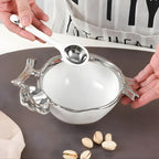 Pomegranate shaped porcelain serving bowl with silver accents