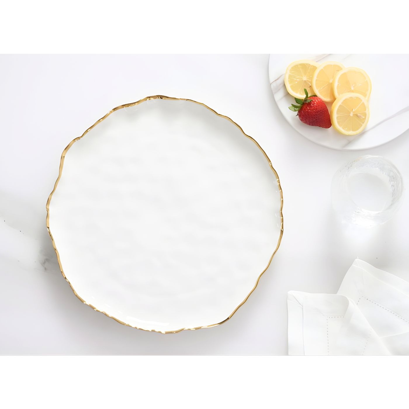 White serving dish round with delicate gold rim