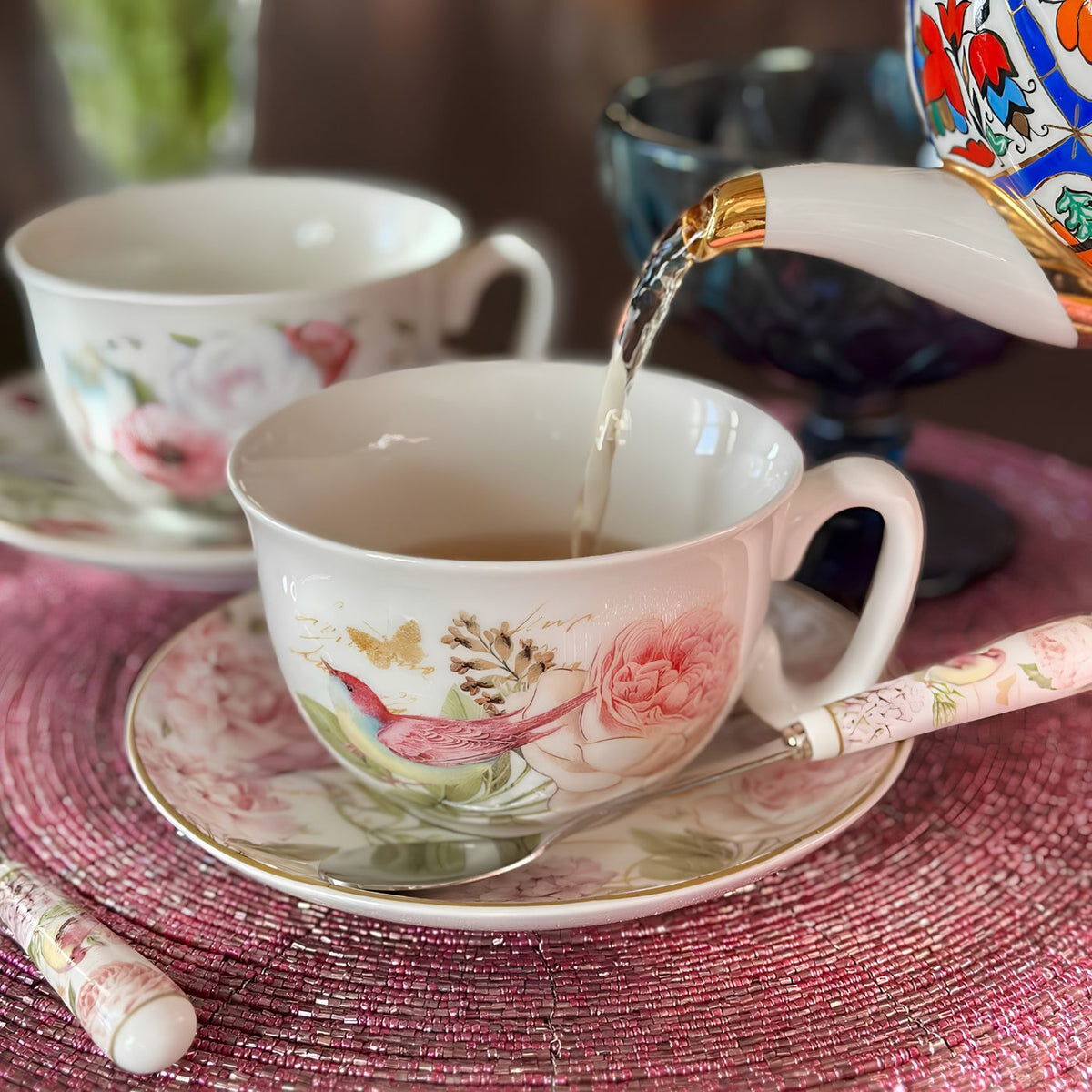 Floral tea cup and saucer with peonies and birds