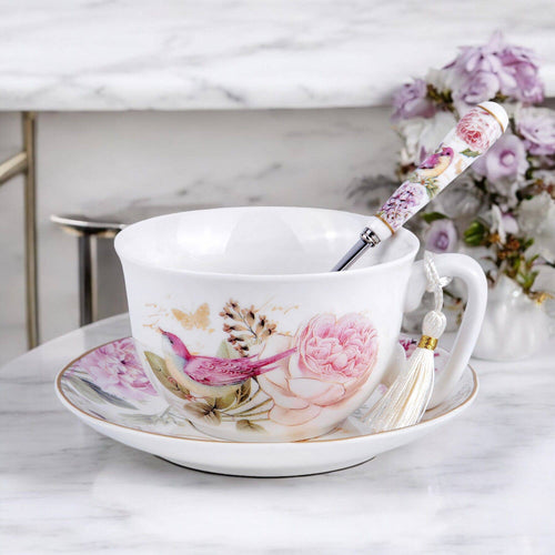 Floral tea cup and saucer with peonies and birds