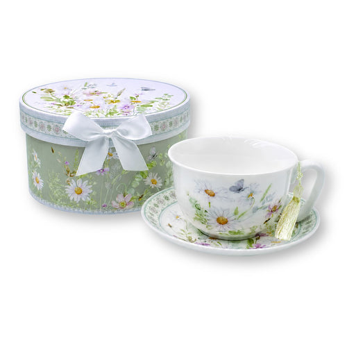 Floral porcelain tea cup with daisies pink wildflowers and butterflies