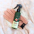 Neem plant spray bottle on pink microfiber glove