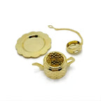 Gold teapot infuser with drip tray top view