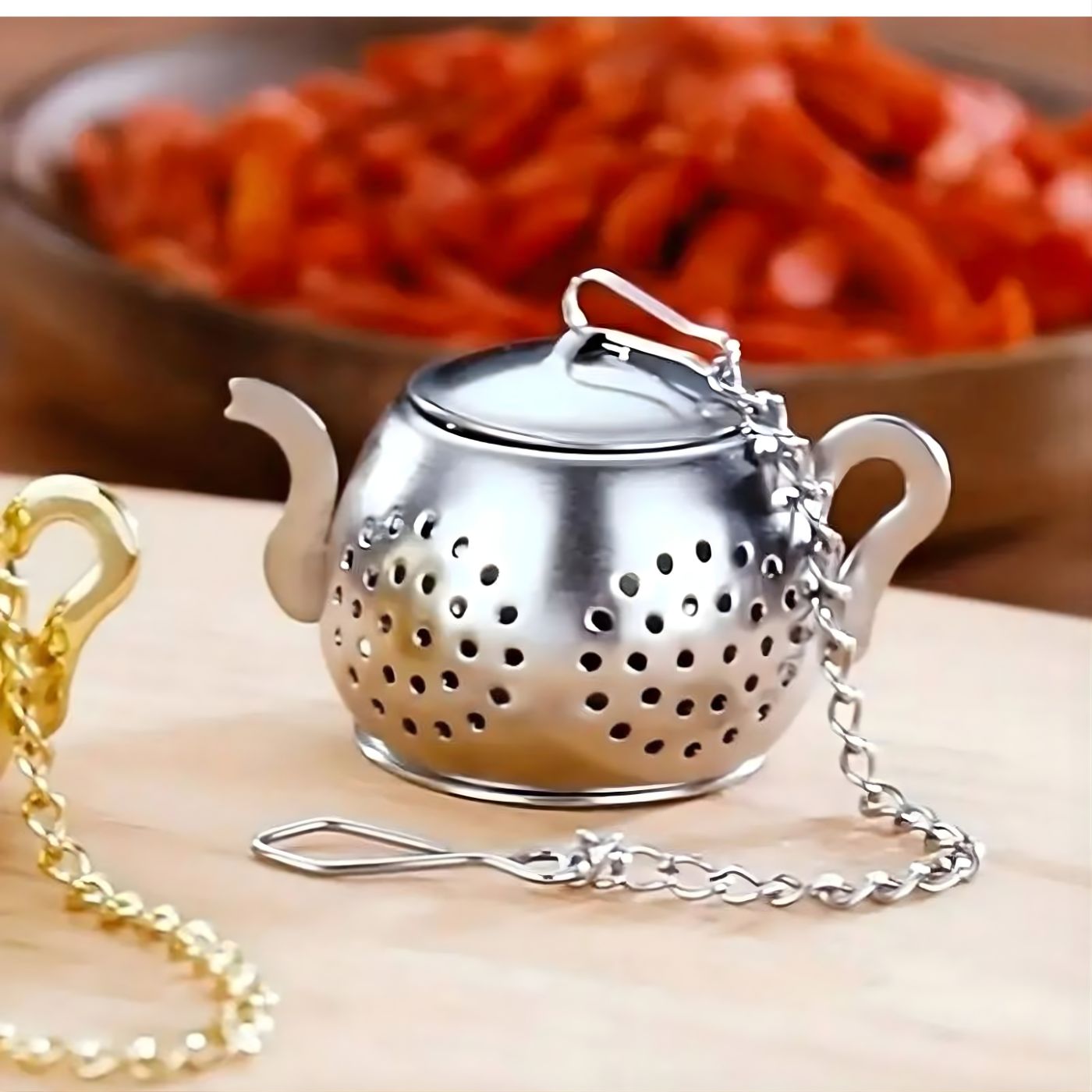 Teapot-shaped loose leaf tea infuser with drip tray