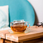 Trendglas Jena glass tea cup with stainless steel infuser on table