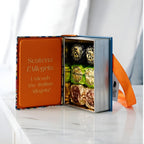 Venchi mini book chocolate tin displayed on table