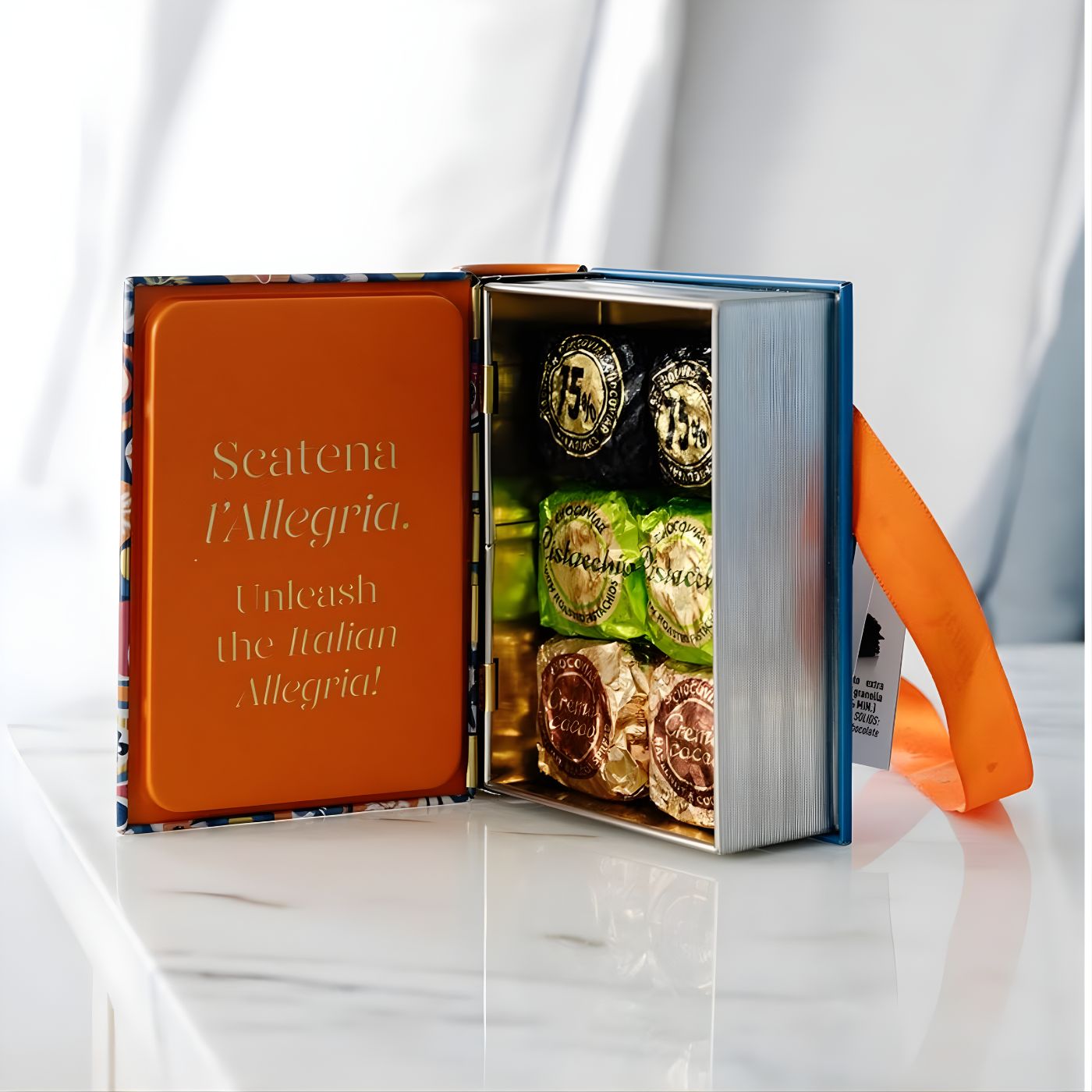 Venchi mini book chocolate tin displayed on table