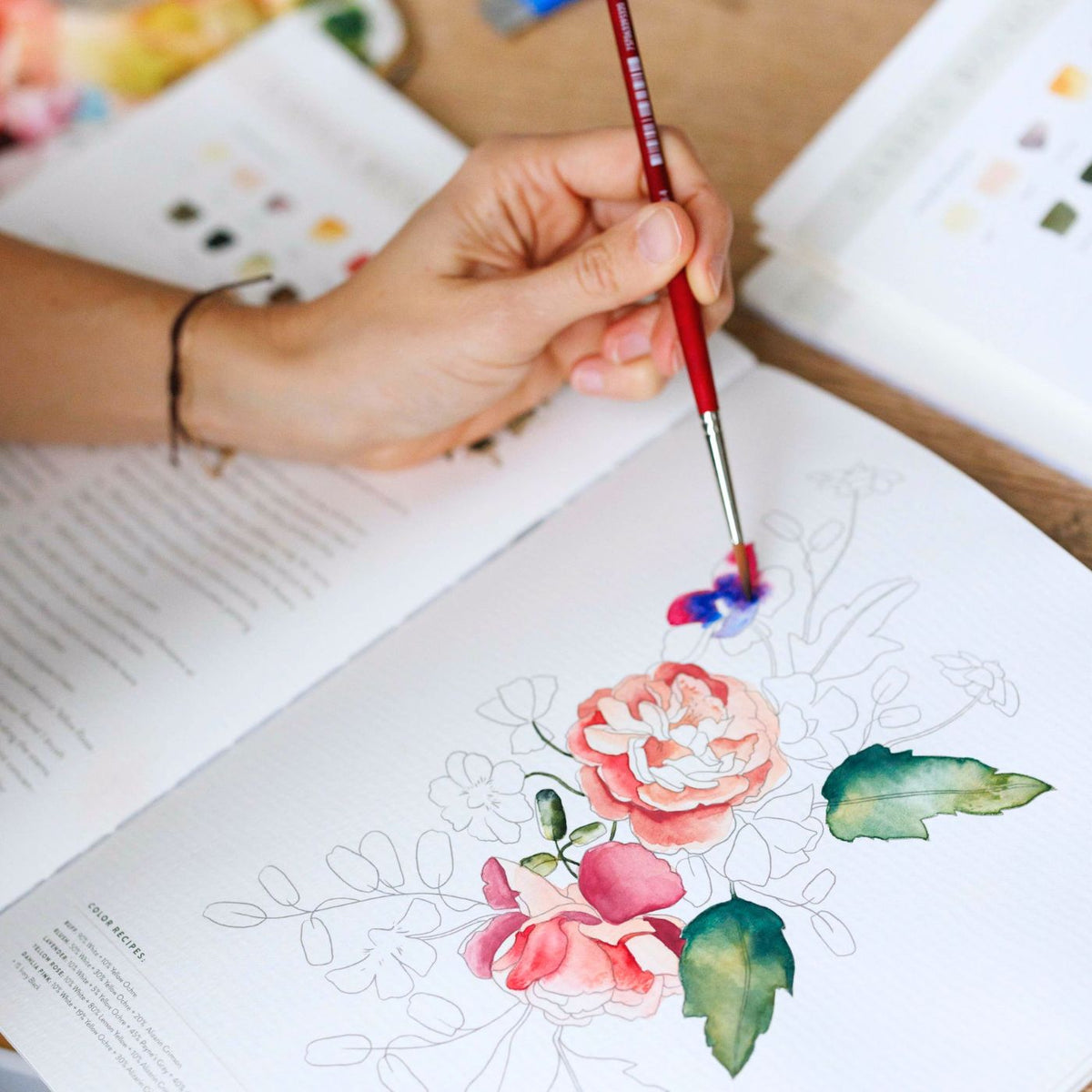 Beginner watercolor workbook with 25 flower and plant projects