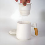 Porcelain tea mug with infuser featuring infuser