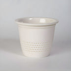 Ceramic tea mug with infuser and lid - infuser close-up