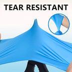 Tear-resistant blue nitrile gloves stretched to demonstrate durability and strength