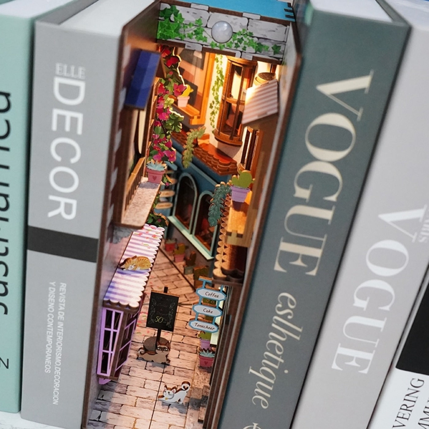 Santorini-inspired miniature book nook with warm LED light