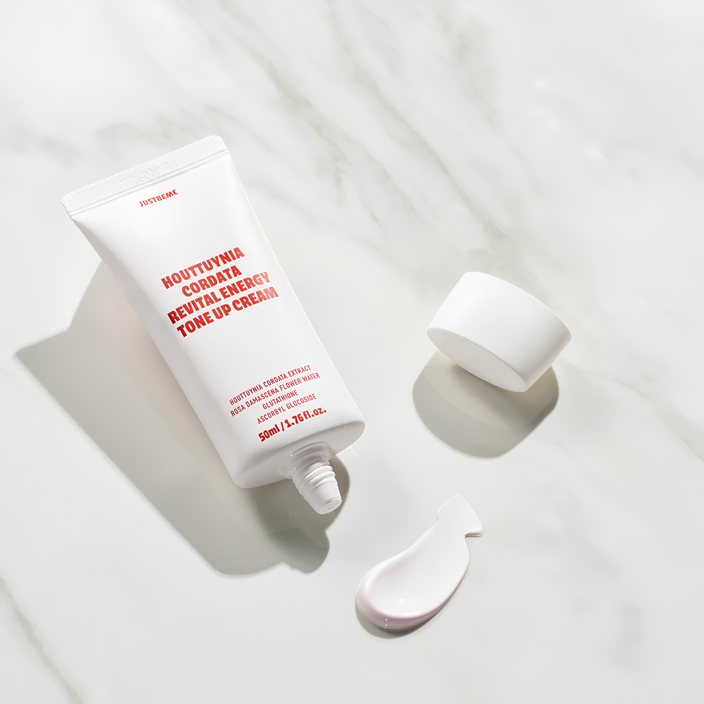 Applying JUSTBEME tone up cream on face