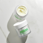 Applying JUSTBEME energy cream on face