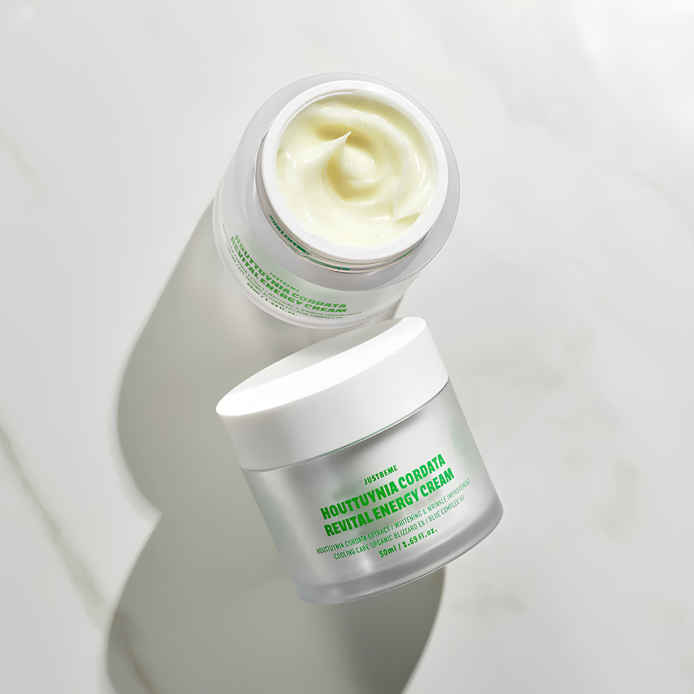 Applying JUSTBEME energy cream on face