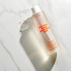 Applying JUSTBEME calming toner on face