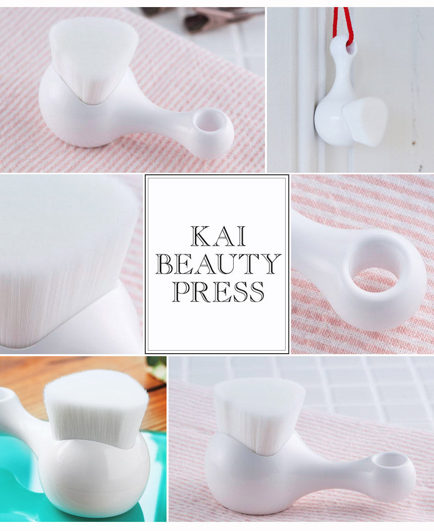 Multiple views of Kai High Density Facial Cleansing Brush showing ergonomic handle, hanging loop, and dense bristle head.