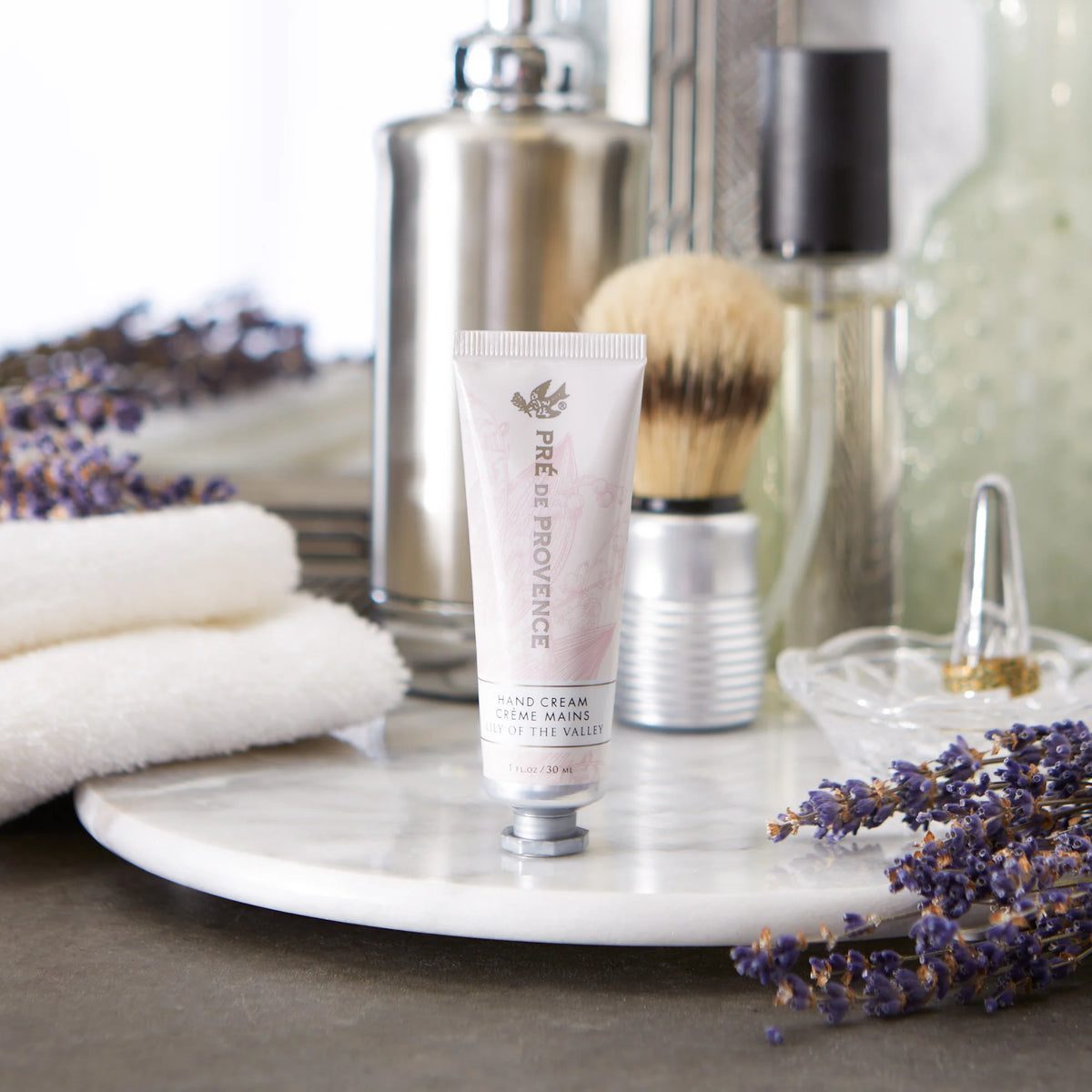 Pré de Provence Lily of the Valley hand cream in a bathroom