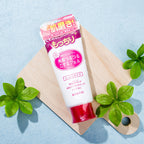 Rosette Gommage Peeling Gel Moisture product tube on wooden board with green leaves.