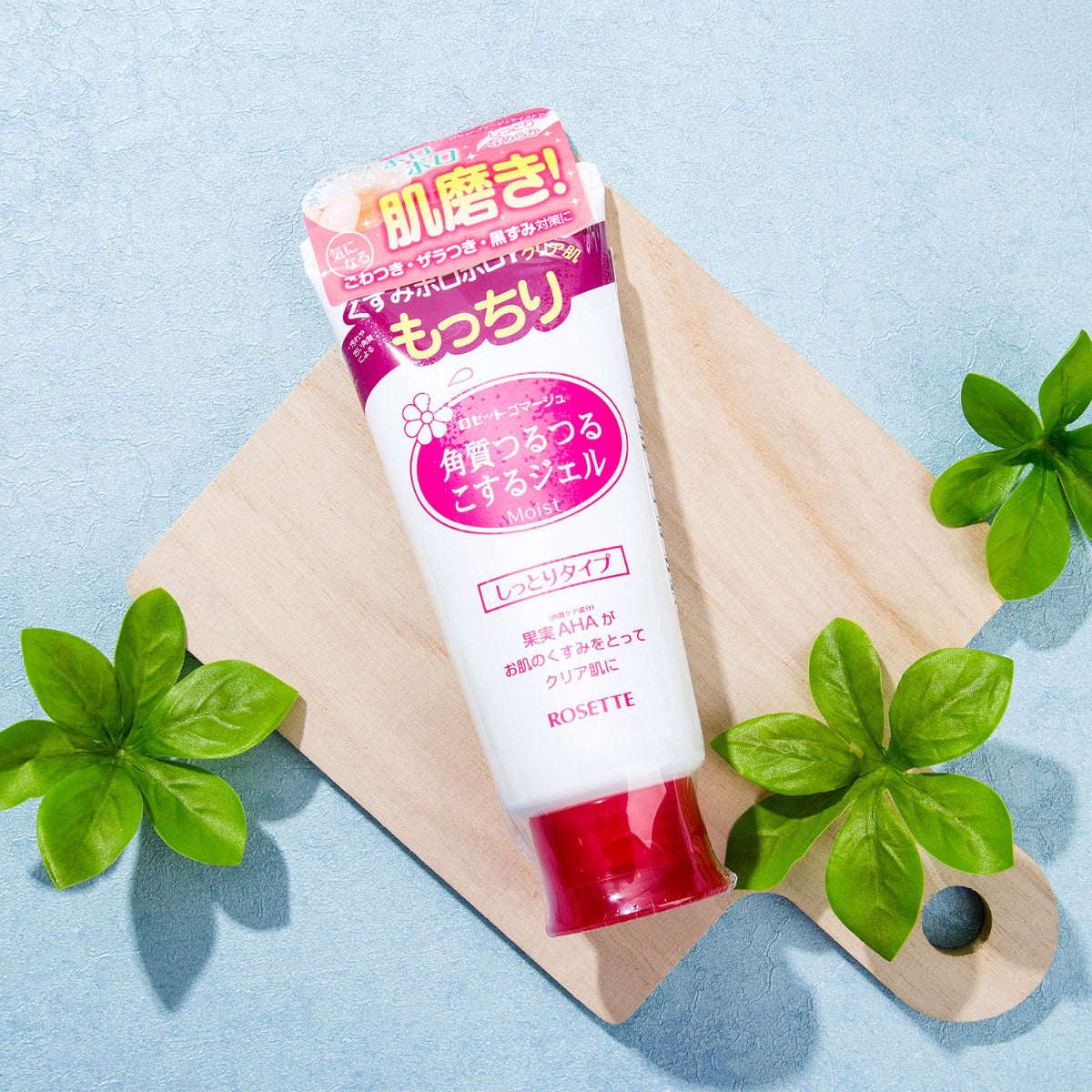 Rosette Gommage Peeling Gel Moisture product tube on wooden board with green leaves.